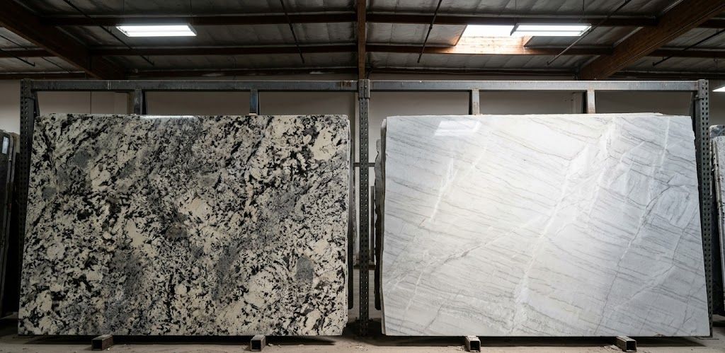 We are looking inside a stone yard where two distinct natural stone slabs are displayed side-by-side.